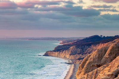 Scenic view of sea against cloudy sky
