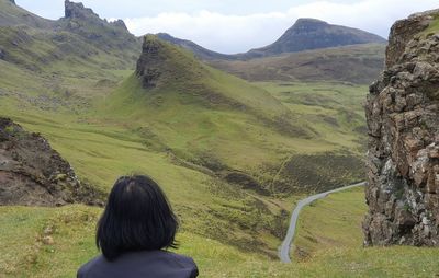 Rear view of woman looking at mountains