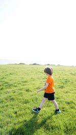 Full length of man on field against clear sky