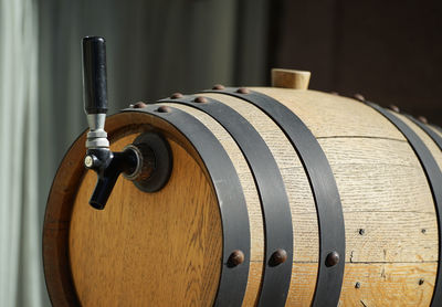 Wooden barrel with handle filled with alcohol