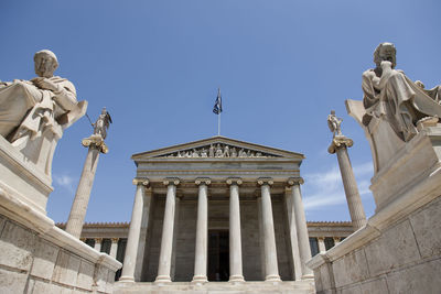 Low angle view of academy of athens against clear sky