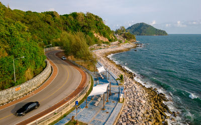 High angle view of road by sea against sky