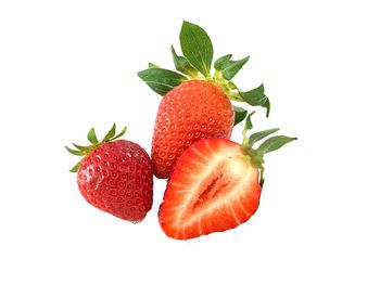 Close-up of strawberry over white background