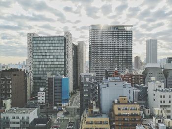 Modern buildings in city against sky