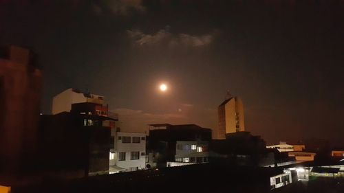 Buildings in city at night