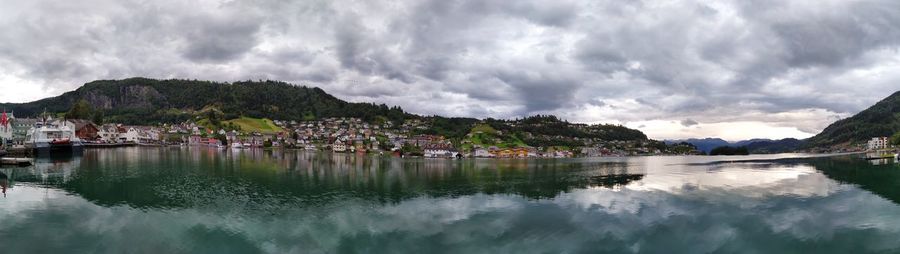 Panoramic view of sailboats moored on mountain against sky