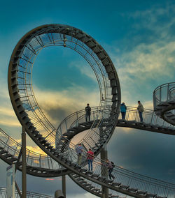 Low angle view of ferris wheel against sky
