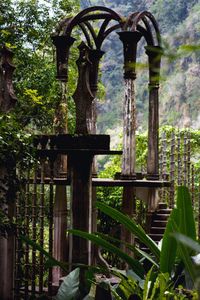 Close-up of built structure against trees