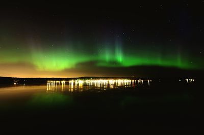 Scenic view of landscape against sky at night