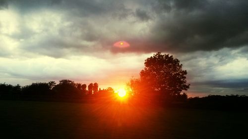 Scenic view of landscape against cloudy sky