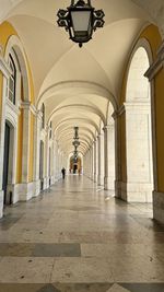 Rear view of man walking in tunnel