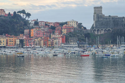 The historic village of lerici on the gulf of poets, illuminated by the sunset light.