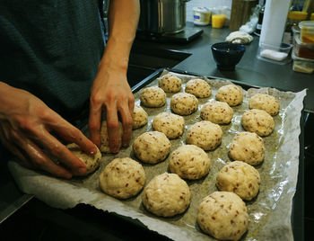 Midsection of man preparing food on table