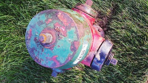 Close-up of old ruin on grassy field