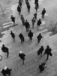 High angle view of people walking on footpath