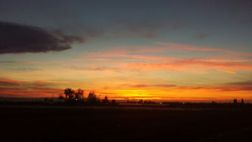 Scenic view of landscape at sunset