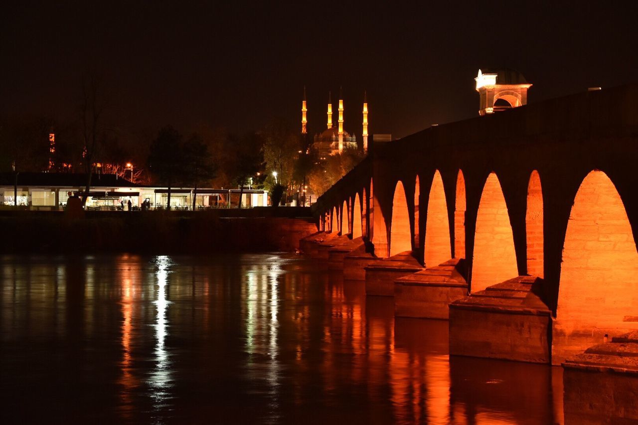 water, built structure, architecture, bridge - man made structure, reflection, connection, waterfront, building exterior, outdoors, no people, river, illuminated, sky, sunset, nature, night, beauty in nature