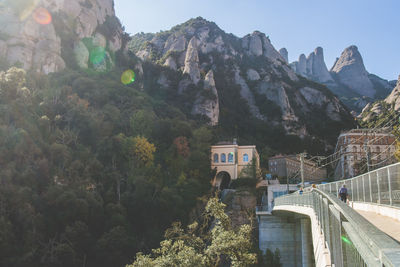 Bridge at santa maria de montserrat abbey against sky