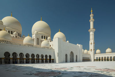 Sheikh zayed grand mosque in abu-dhabi. view of mosque against clear blue sky