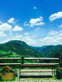 Scenic view of mountains against cloudy sky