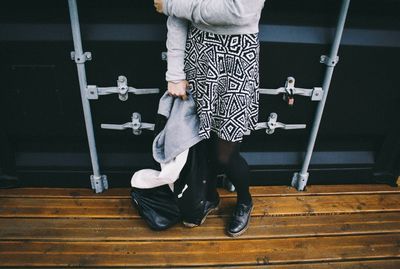 Woman standing on hardwood floor