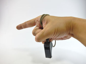 Close-up of woman hand against white background