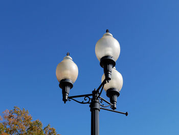 Low angle view of street light against clear sky