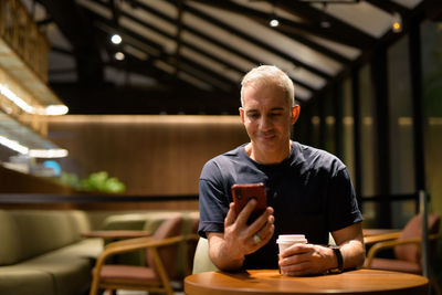 Young man using mobile phone