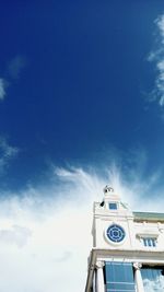 Low angle view of clock tower against sky