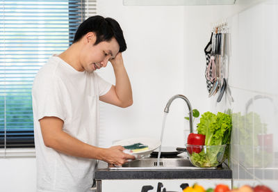 Doctor examining chemical in kitchen