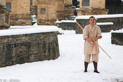 Full length of man standing on snow