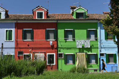 Residential buildings against blue sky