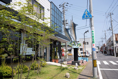 Street amidst houses and buildings in city