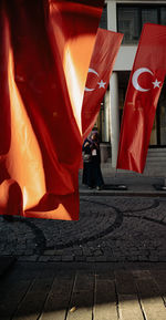 Low section of woman standing on street