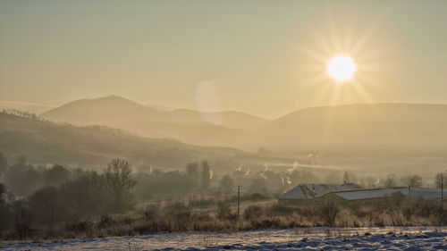 Scenic view of mountains against sky during sunset