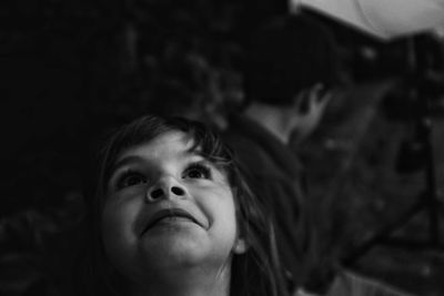 Close-up of girl looking up