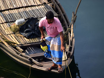Full length of man on boat in canal