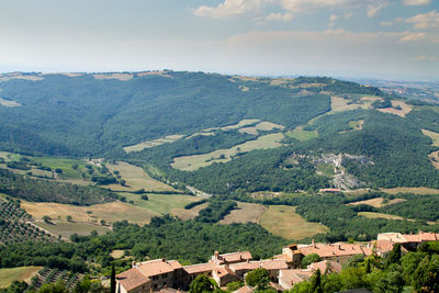 Aerial view of landscape and buildings against sky