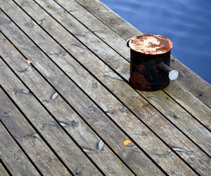 High angle view of rusty bollard on pier