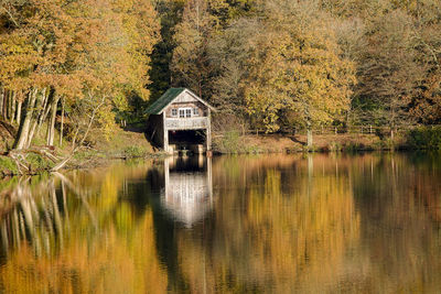 House by lake in forest