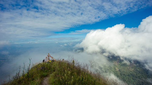 Scenic view of waterfall against sky