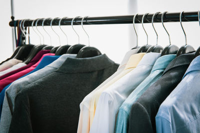 Clothes hanging on rack in store