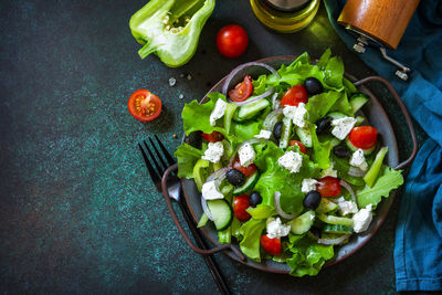 Healthy diet food. greek salad of feta cheese, fresh cucumber, tomato, sweet pepper, lettuce. 