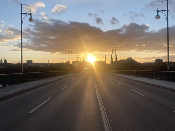 View of road against sunset sky