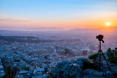 High angle view of buildings against sky during sunset