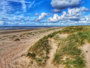 Scenic view of beach against sky