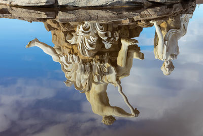 Statue reflecting in the water 