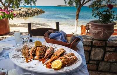 Food on table by sea