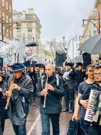 People standing on street in city