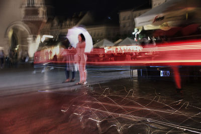 Light trails on street in city at night